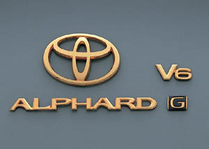 Gold emblem (the Toyota symbol (for rear)) (Car name logograph (for rear)) (Aerodynamic volume displacement mark (V6))