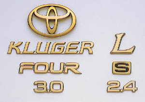Gold emblem (car name logograph (for rear)) (Aerodynamic volume displacement mark) (rear drive) (the Toyota symbol (for rear))