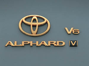 Gold emblem (the Toyota symbol (for rear)) (Car name logograph (for rear)) (Aerodynamic volume displacement mark (V6))